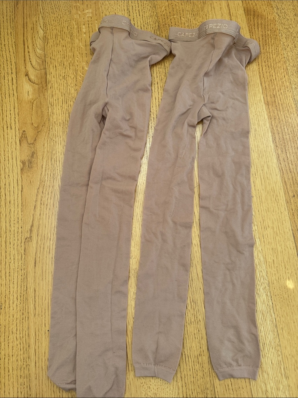Capezio Girls' Hold and Stretch Stirrup Tight in Suntan